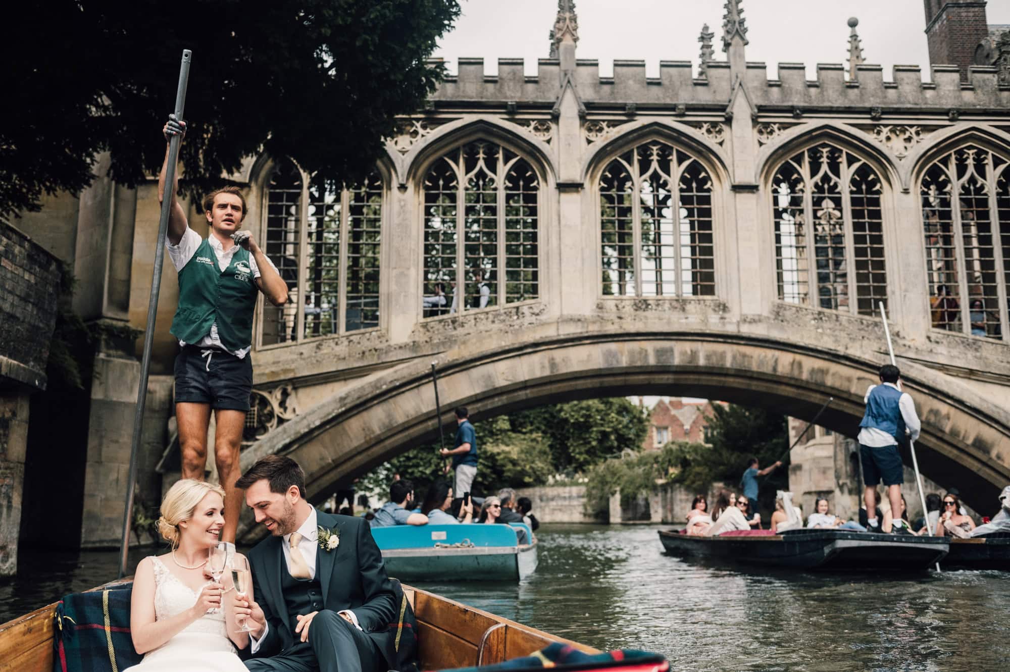 Bride and Groom on a punt on the river cam during their wedding day in Cambridge