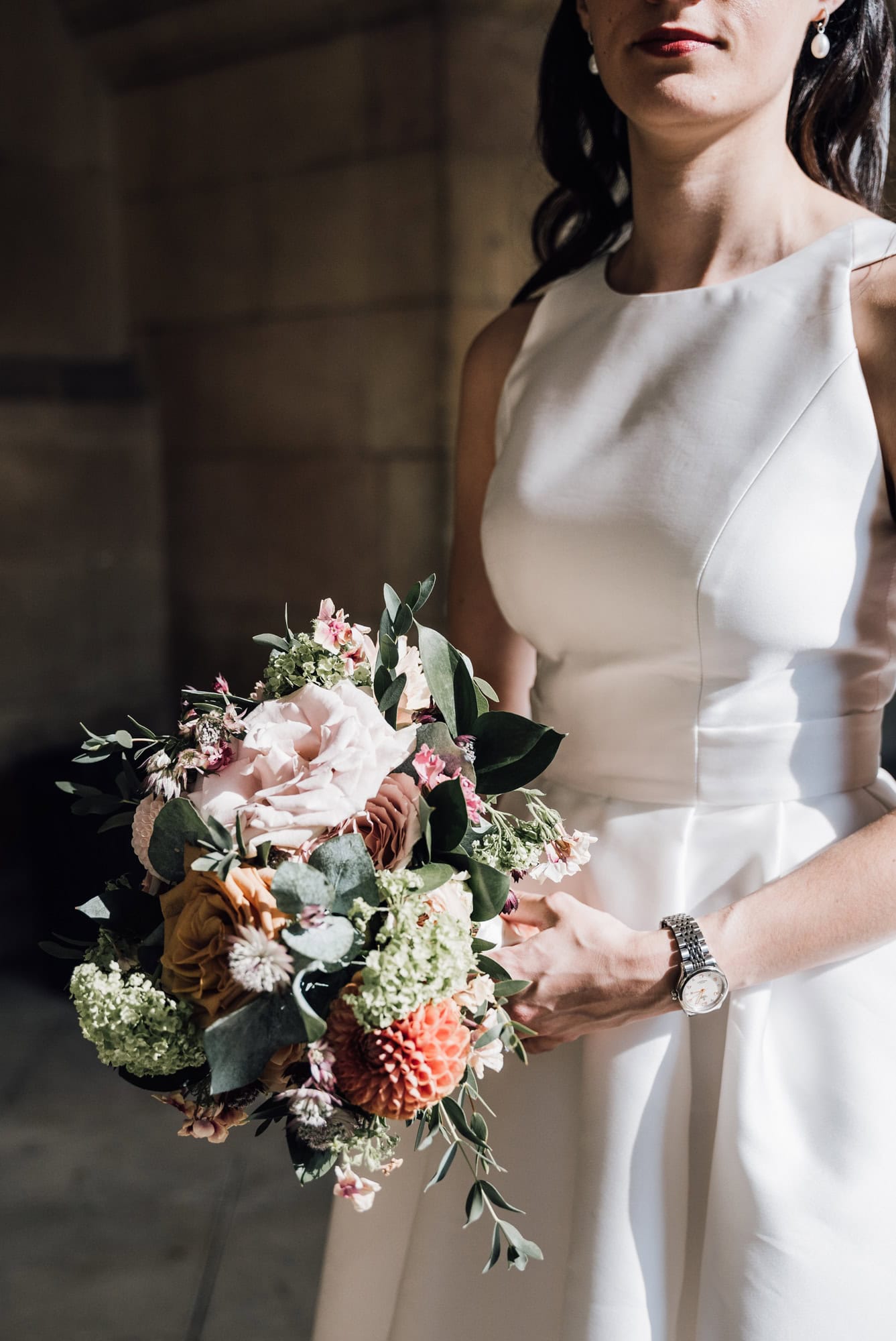 Bride holding her floral display.