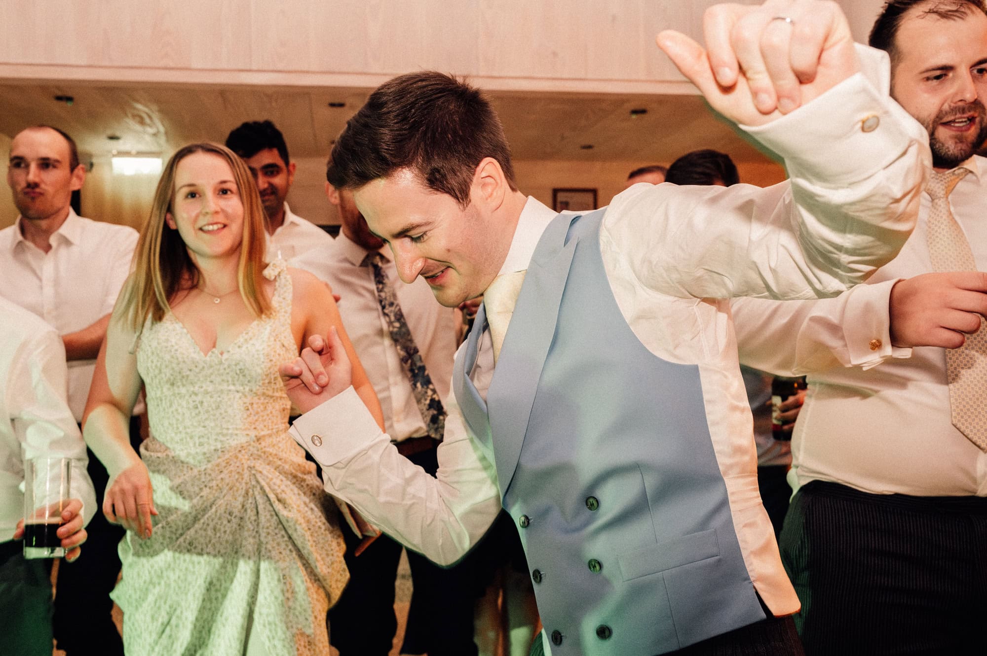The groom hits the dance floor at his wedding at Emmanuel College in Cambridge