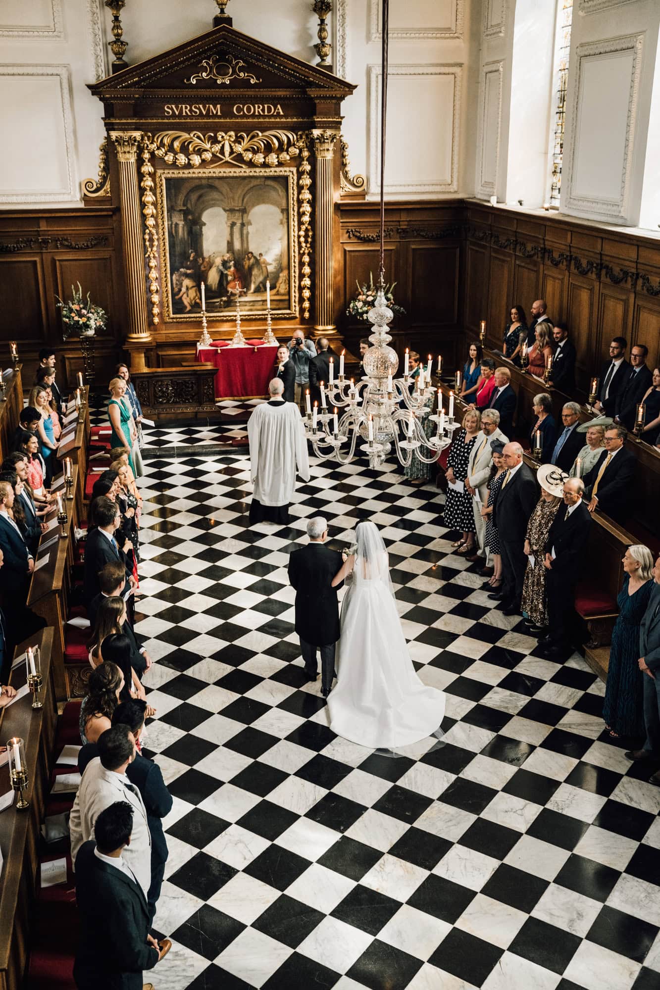 Wedding ceremony in the grand setting of the chapel at Emmanuel College in Cambridge