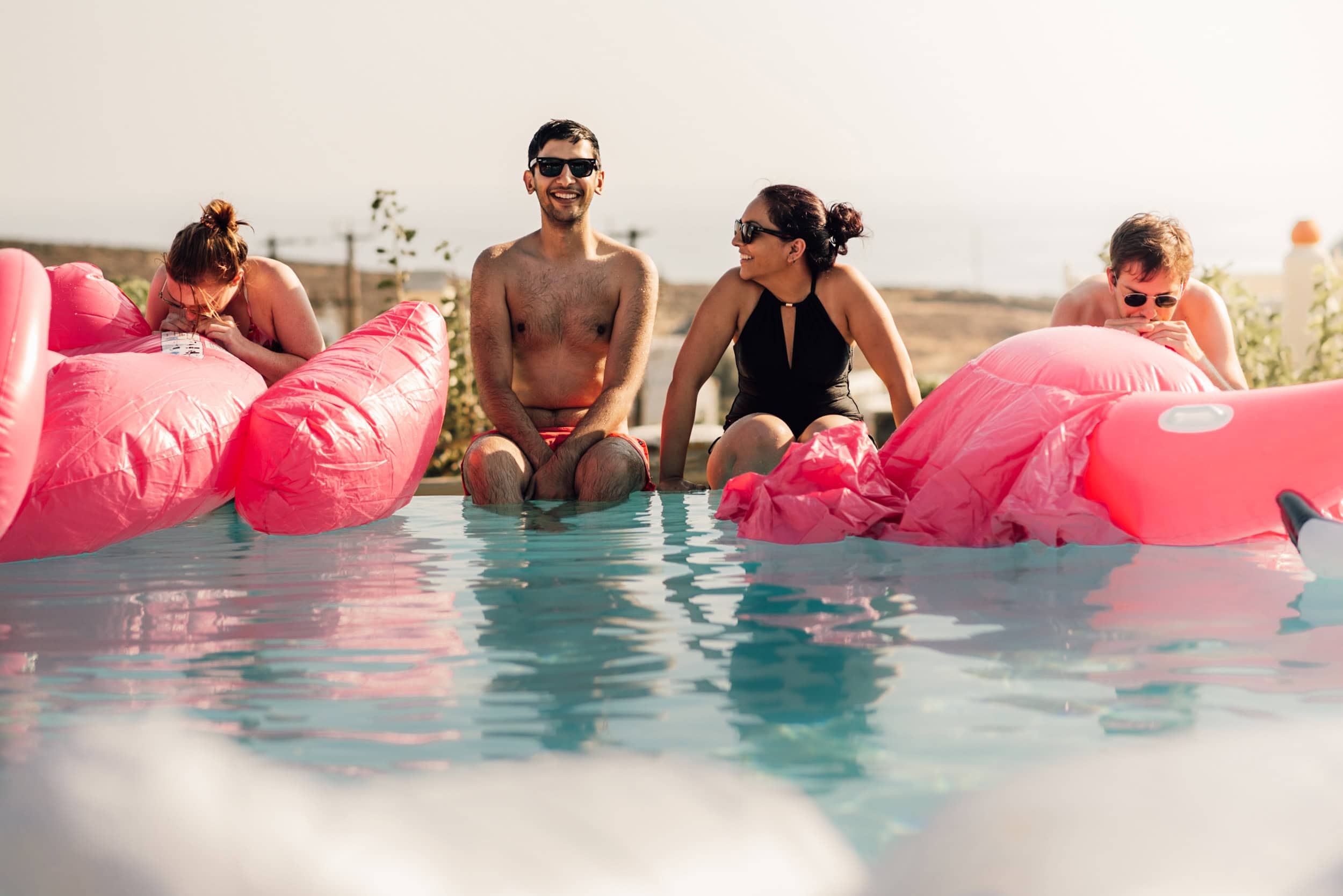 Guests enjoying the pool at Diles & Rinies Luxury destination wedding in Greece