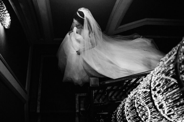 Bride descending the stairs at Corinthia Hotel Wedding in London