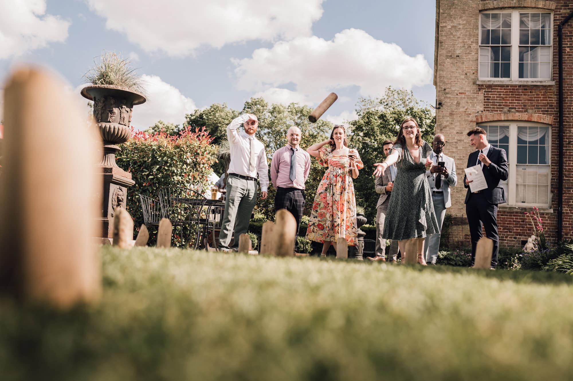 Guest playing garden games at Shortmead House Wedding