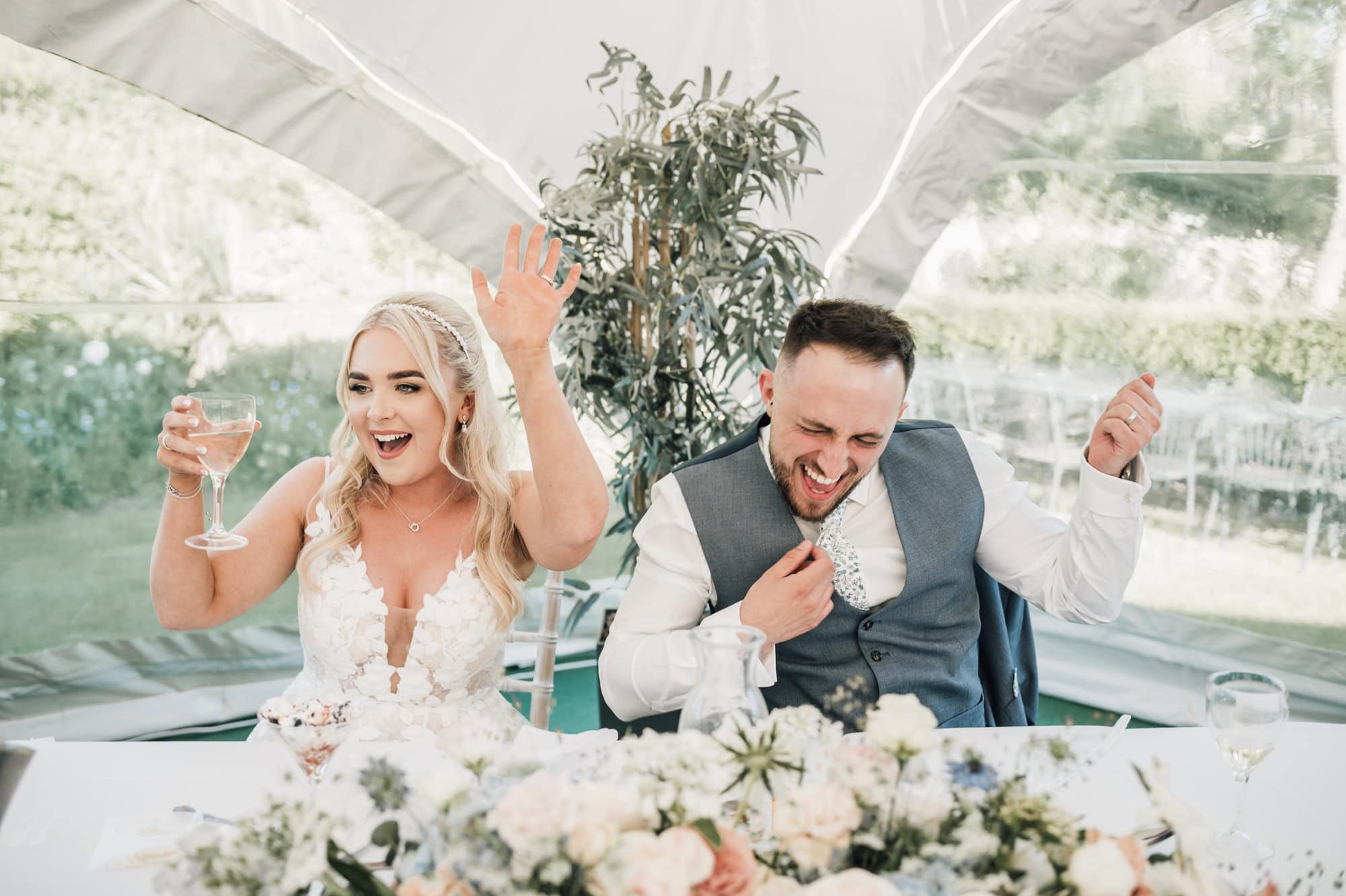 Bride and Groom "rocking out" to singing waiter 