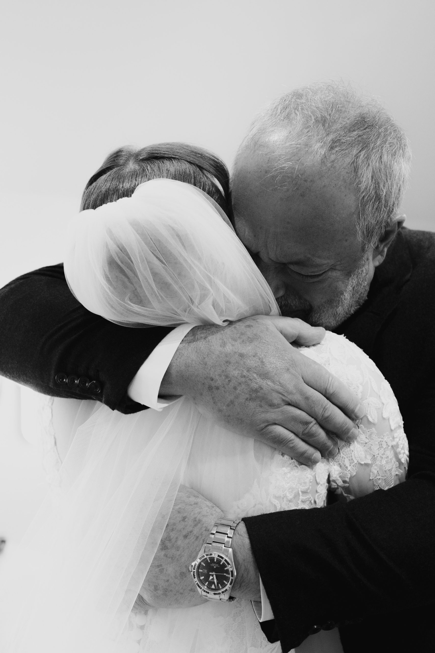 Bride being hugged by here Dad at Gaynes Park Wedding in Essex