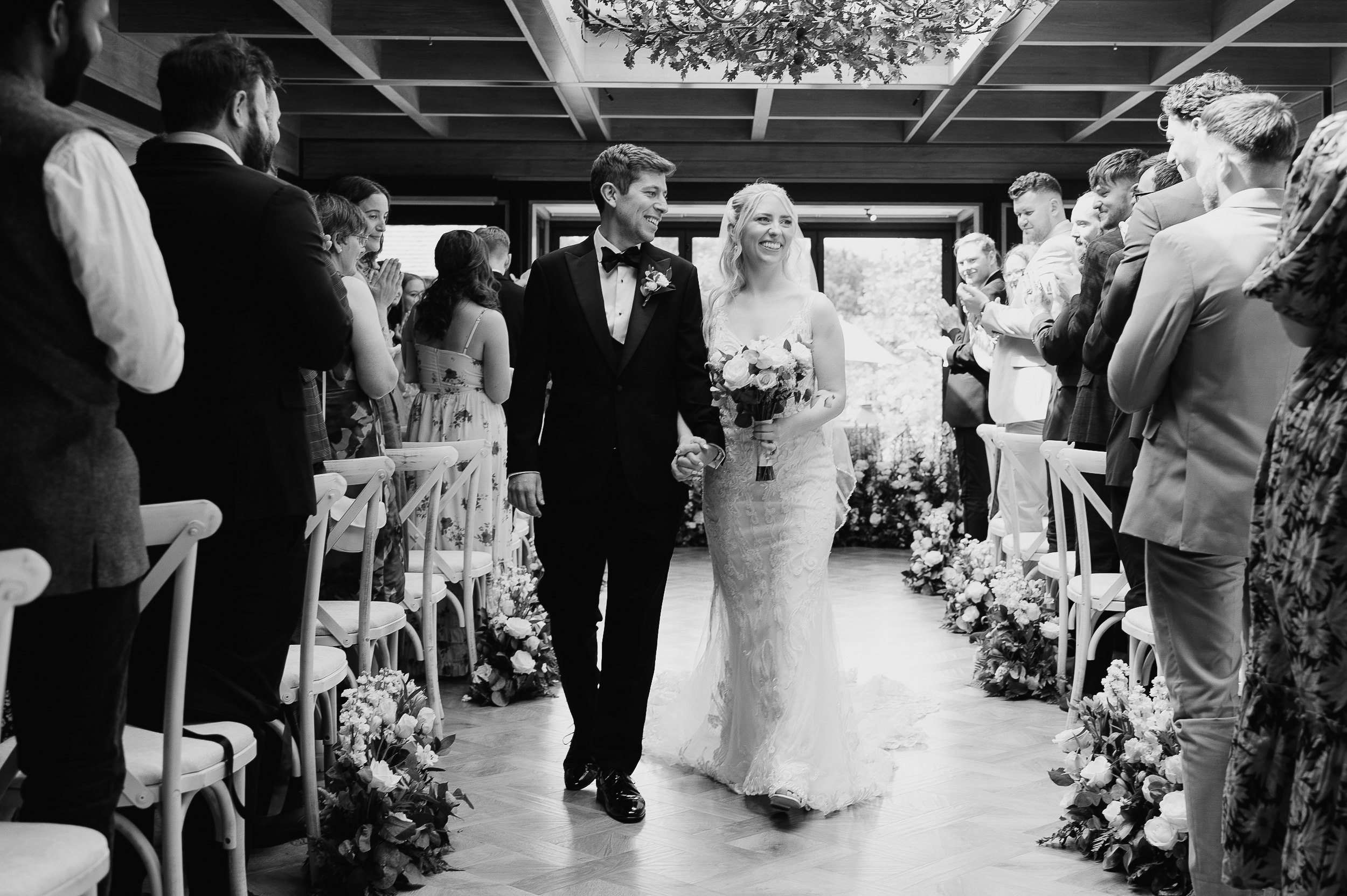 Stylish black tie wedding ceremony in the orangery at The Old Hall in ely