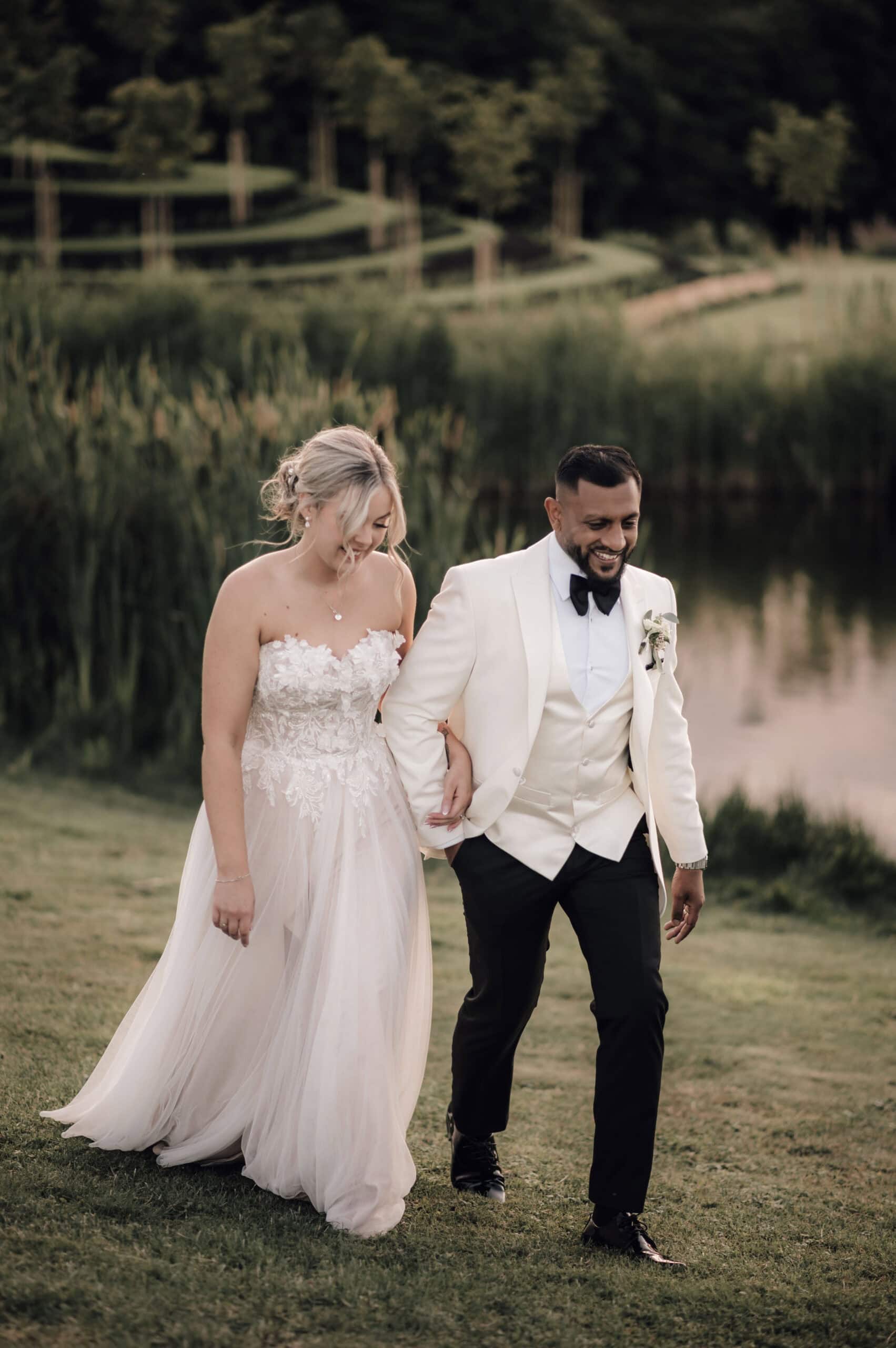 Bride and Groom Walking at The Old Hall in Ely by Damien Vickers Photography