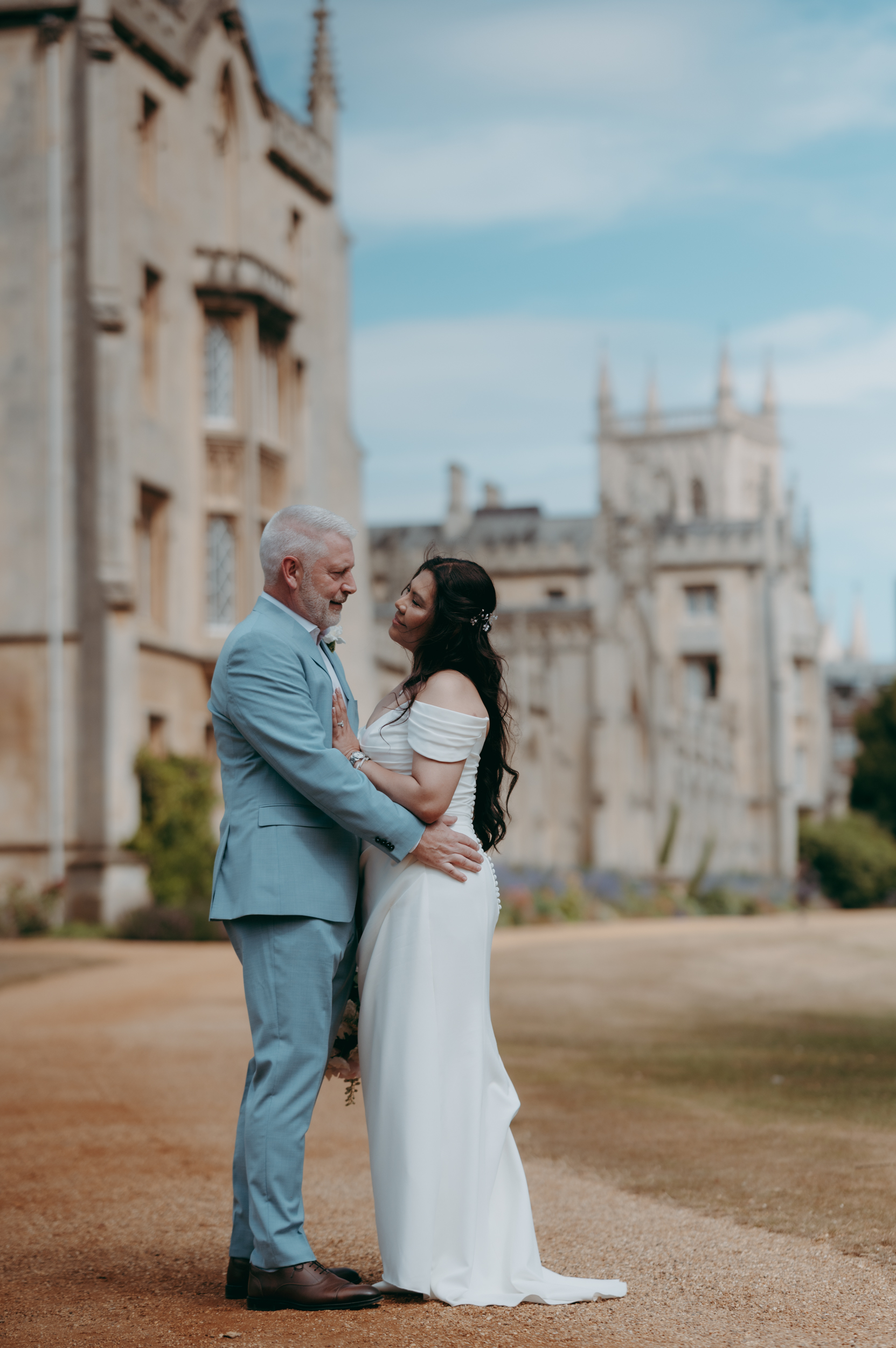 Newlywed couple in the grounds at St John's College in Cambridge