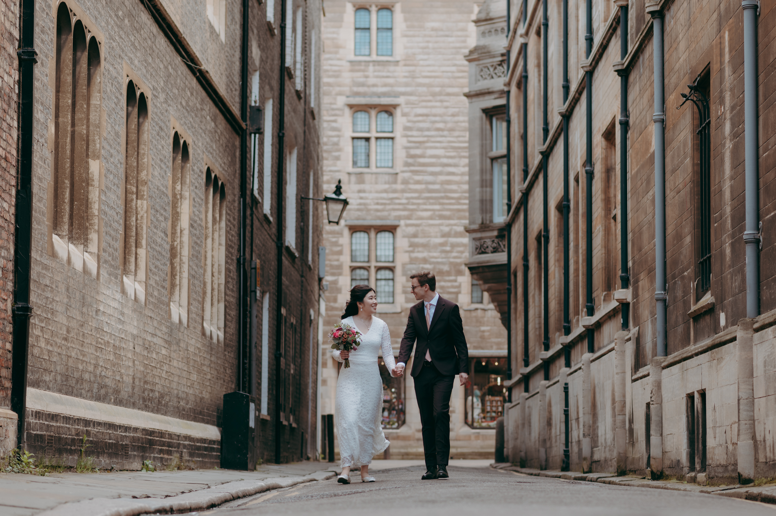 Bride and groom during early morning wedding photoshoot in Cambridge